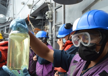 USS Lake Champlain conducts replenishment-at-sea in the South China Sea