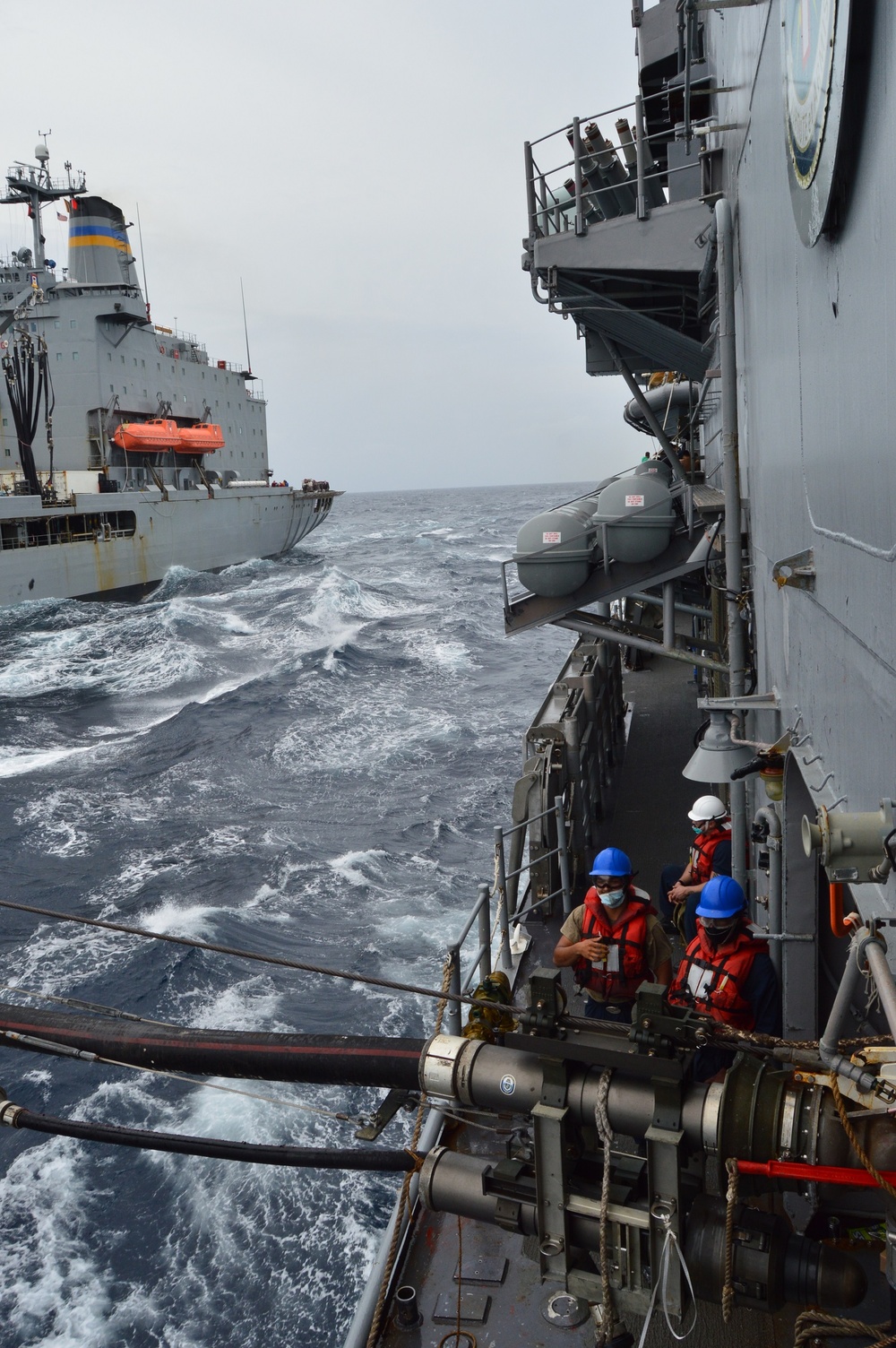 USS Lake Champlain conducts replenishment-at-sea in the South China Sea