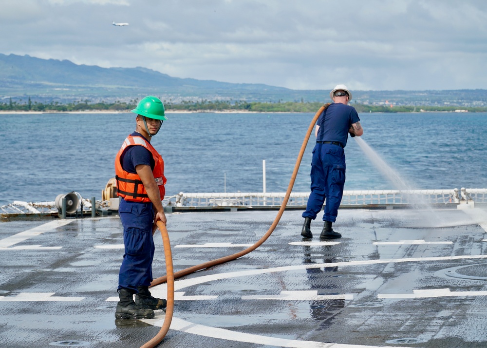 USCG Cutter Stratton crew conduct wash down of flight deck