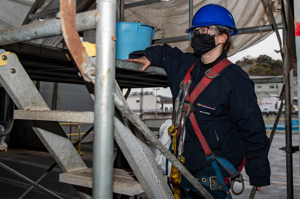 USS Ronald Reagan (CVN 76) Sailors Perform Maintenance On The Hangar Bay