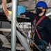 USS Ronald Reagan (CVN 76) Sailors Perform Maintenance On The Hangar Bay