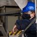 USS Ronald Reagan (CVN 76) Sailors Perform Maintenance On The Hangar Bay