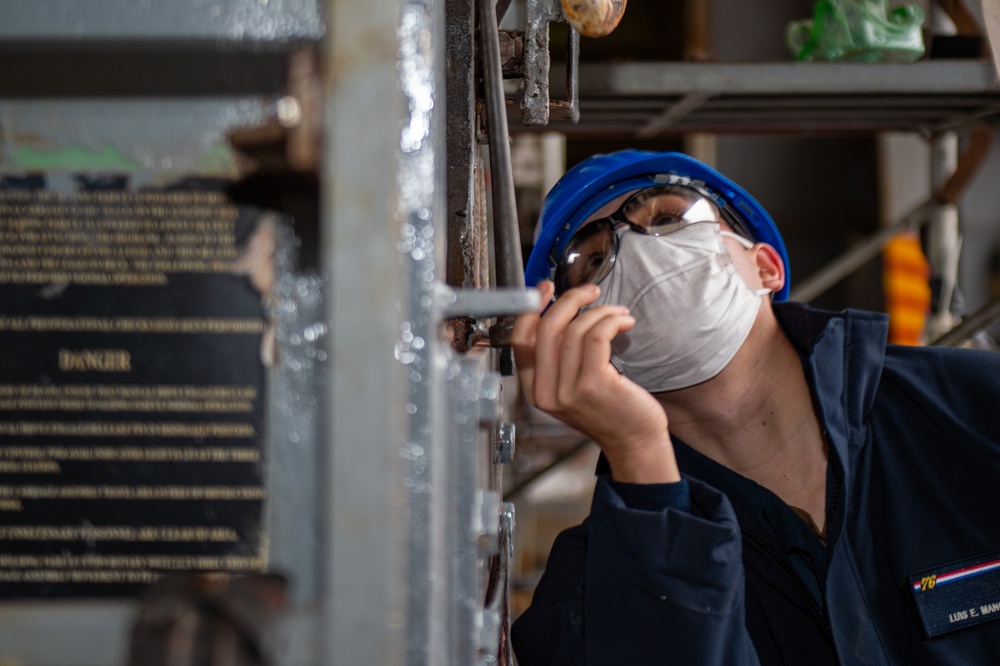 USS Ronald Reagan (CVN 76) Sailors Perform Maintenance On The Hangar Bay