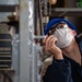 USS Ronald Reagan (CVN 76) Sailors Perform Maintenance On The Hangar Bay