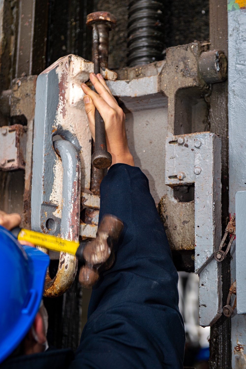 USS Ronald Reagan (CVN 76) Sailors Perform Maintenance On The Hangar Bay