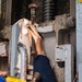 USS Ronald Reagan (CVN 76) Sailors Perform Maintenance On The Hangar Bay