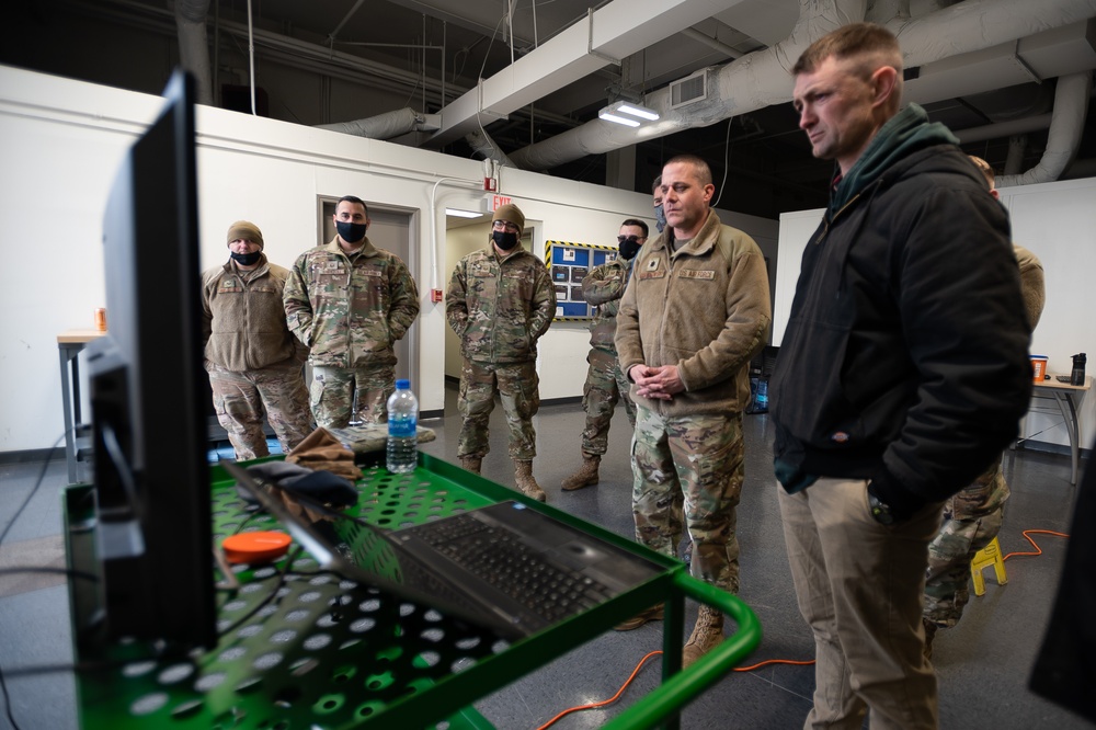 U.S. Air Force Lt. Col Mark Szatkowski tests an autonomous vehicle for flight line use