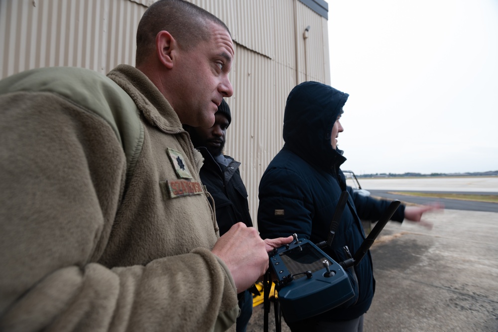 U.S. Air Force Lt. Col Mark Szatkowski tests an autonomous vehicle for flight line use