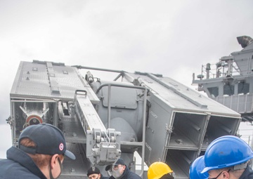 USS America (LHA 6) sailors,  load up Evolved Sea Sparrow missiles.