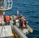 Sailors Aboard USS Ralph Johnson (DDG 114) Conduct Boat Operations