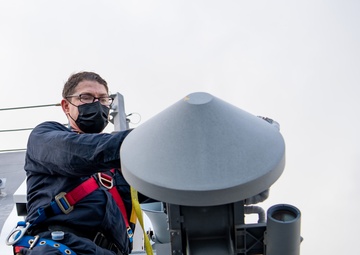 Sailor aboard USS Charleston conducts maintenance on UAV Automatic Recovery System