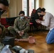 U.S. Soldiers train with Polish students on basic combat lifesaver skills