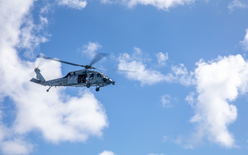 HSC 22 Sea Hawk Helicopter Flies Above USS Milwaukee