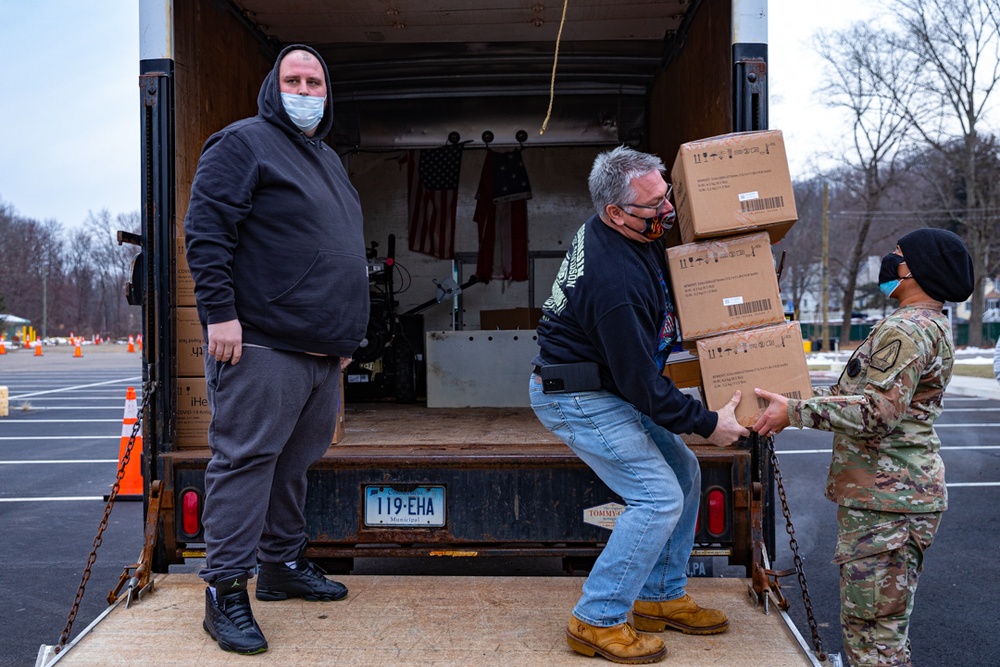 Connecticut's Home Team distribute test kits and masks to stop the spread.