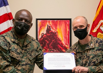 Chaplain presents gifts to CLR-37 Commanding Officer on behalf of Pohang Sunrin, Republic of Korea