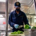USS Charleston Culinary Specialist Prepares Bell Peppers