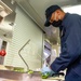 USS Charleston Culinary Specialist Prepares Bell Peppers