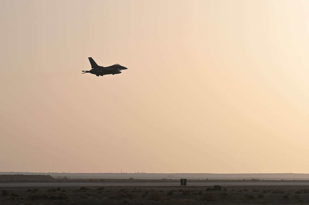 332ND AEW maintenance Airmen, aircraft at sunset