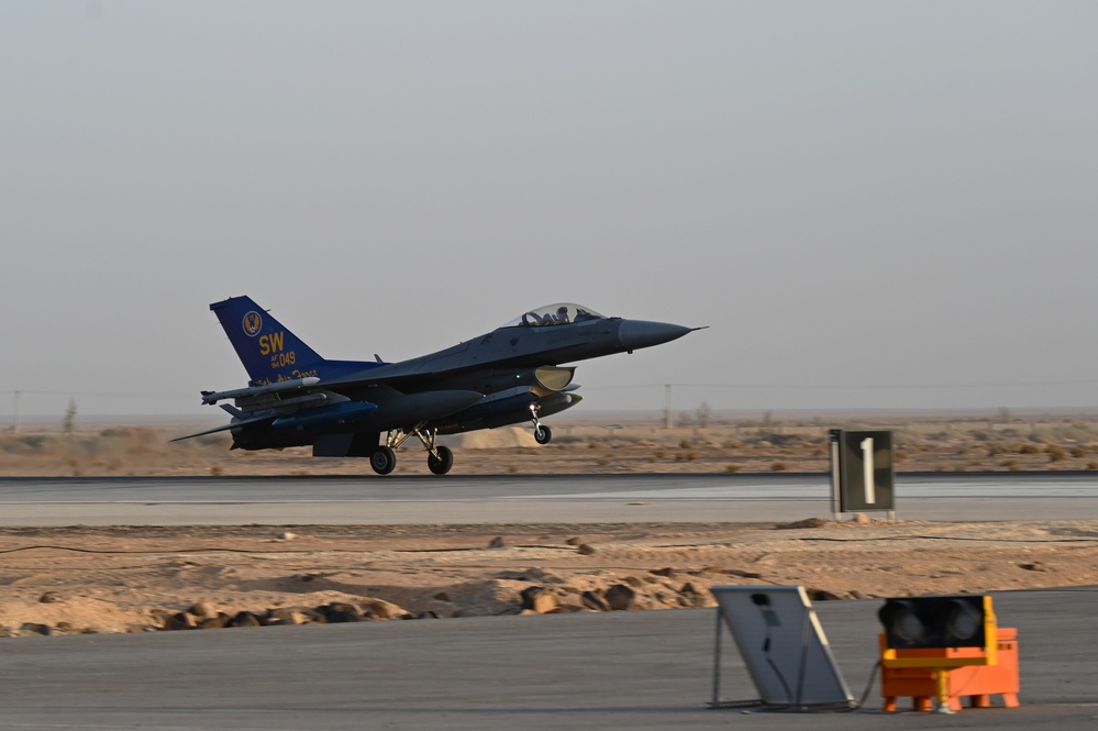 332ND AEW maintenance Airmen, aircraft at sunset