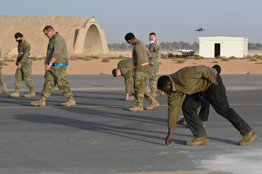 332ND AEW maintenance Airmen, aircraft at sunset