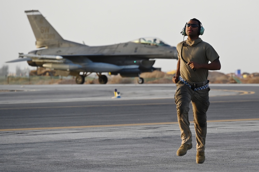 332ND AEW maintenance Airmen, aircraft at sunset