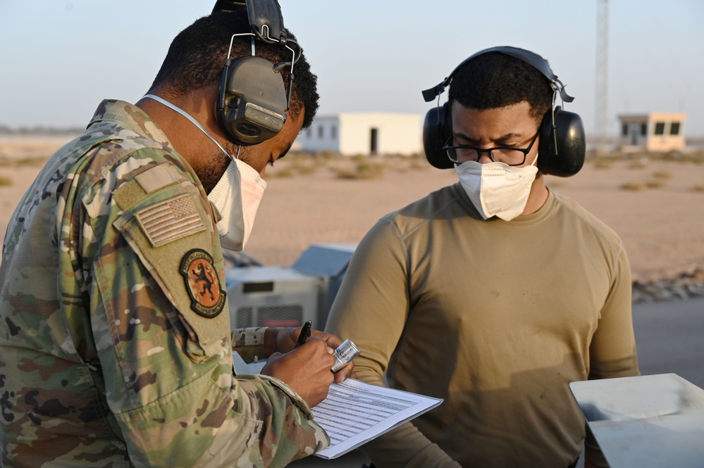 332ND AEW maintenance Airmen, aircraft at sunset