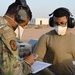 332ND AEW maintenance Airmen, aircraft at sunset