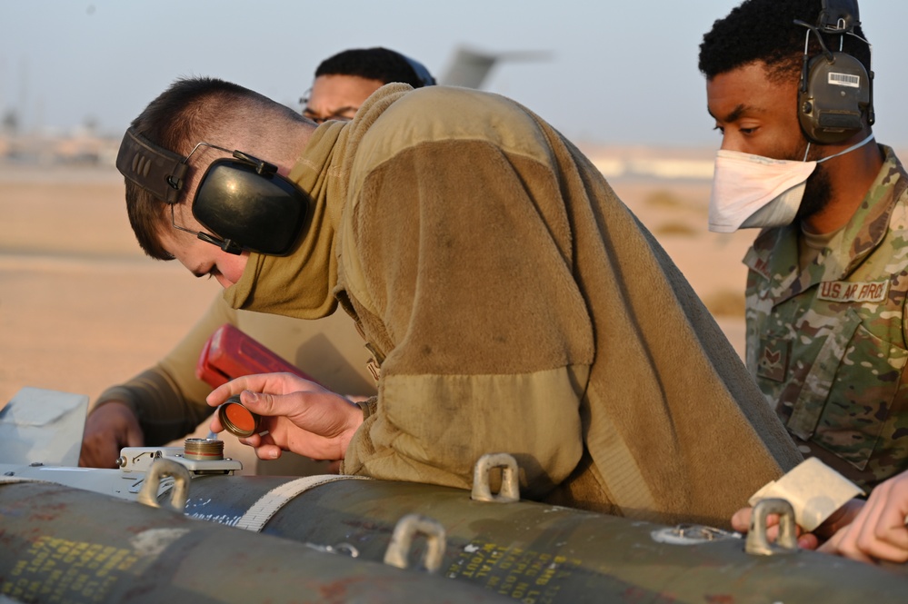 332ND AEW maintenance Airmen, aircraft at sunset