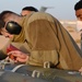 332ND AEW maintenance Airmen, aircraft at sunset