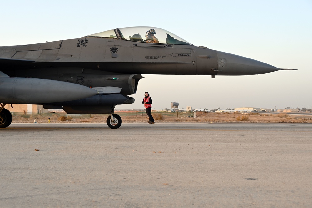 332ND AEW maintenance Airmen, aircraft at sunset