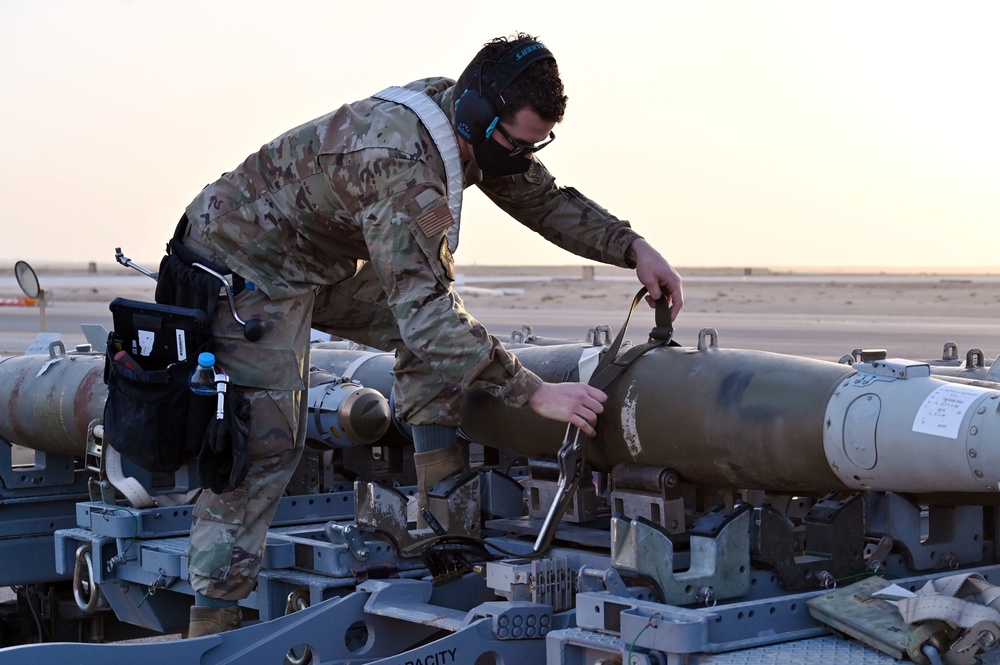 332ND AEW maintenance Airmen, aircraft at sunset