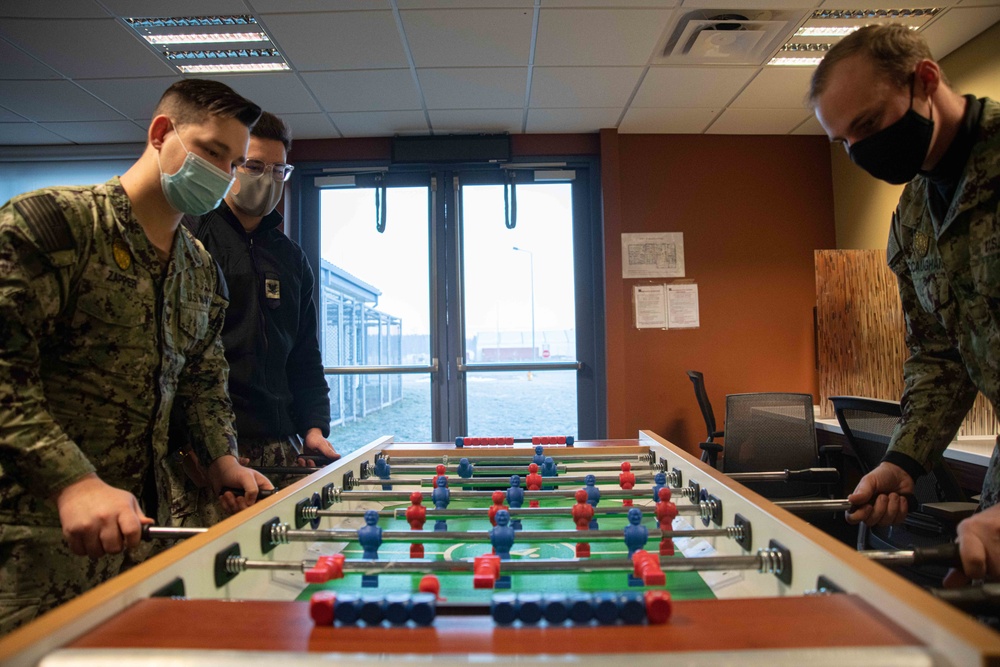 Sailors assigned to Naval Support Facility Redzikowo, play foosball