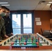 Sailors assigned to Naval Support Facility Redzikowo, play foosball