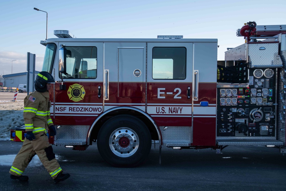 Firefighters assigned to Naval Support Facility Redzikowo, test firehose nozzles