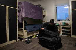 Master-at-Arms Seaman Recruit Jon Ramos, from the Bay Area, assigned to Naval Support Facility Redzikowo, moves into Multipurpose Facility onboard NSF Redzikowo