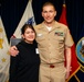 Father administers oath of enlistment to daughter