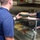 Photo of Coast Guardsman Serving Lunch
