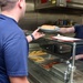 Photo of Coast Guardsman Serving Lunch