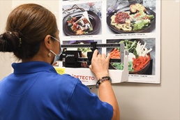 Health Promotion Nurse Checks Weight on Scale