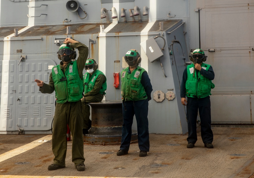 Sailors Aboard USS Ralph Johnson (DDG 114) Conduct Flight Operations