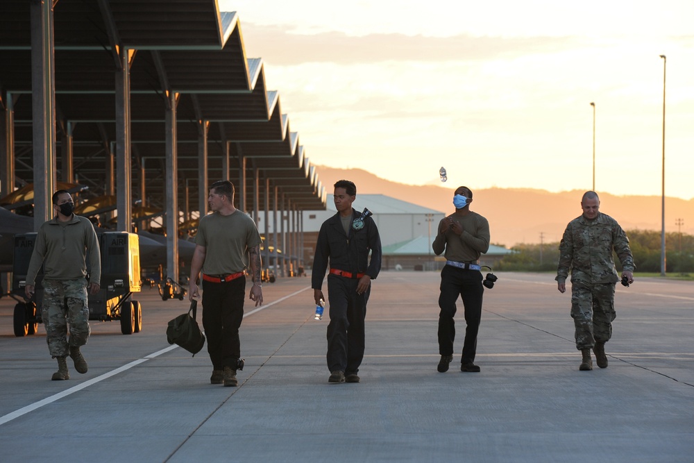 Total Force crew chiefs clear FOD for F-22 ops