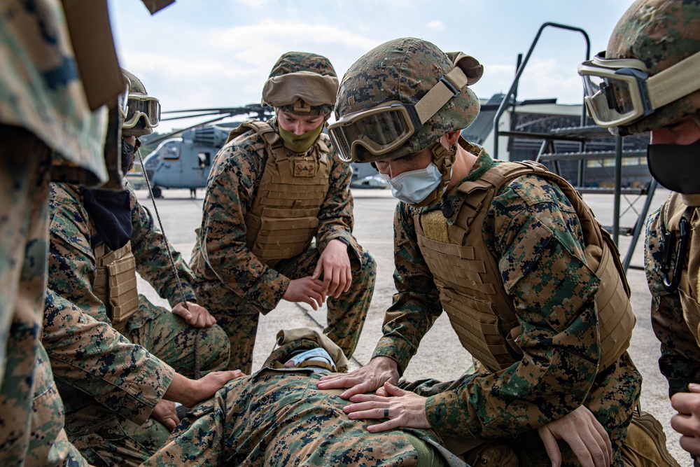 Marines with Combat Logistics Regiment 37 conduct air casualty evacuation drills