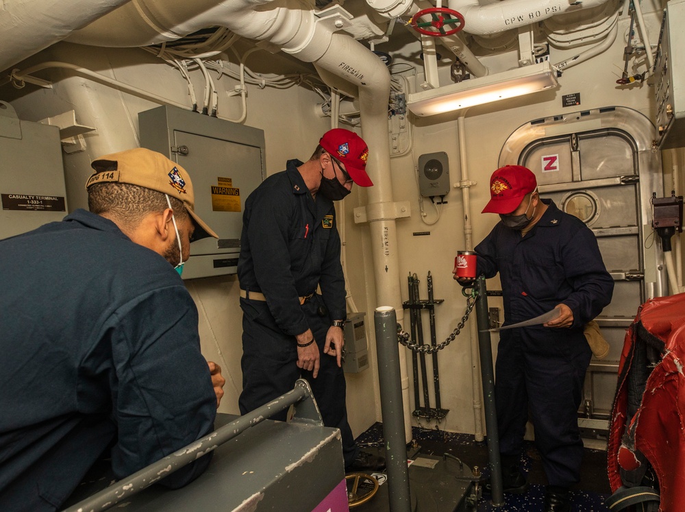 Sailors Aboard USS Ralph Johnson (DDG 114) Conduct General Quarters Drill