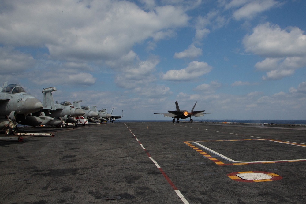 Blue and green F-35s work together