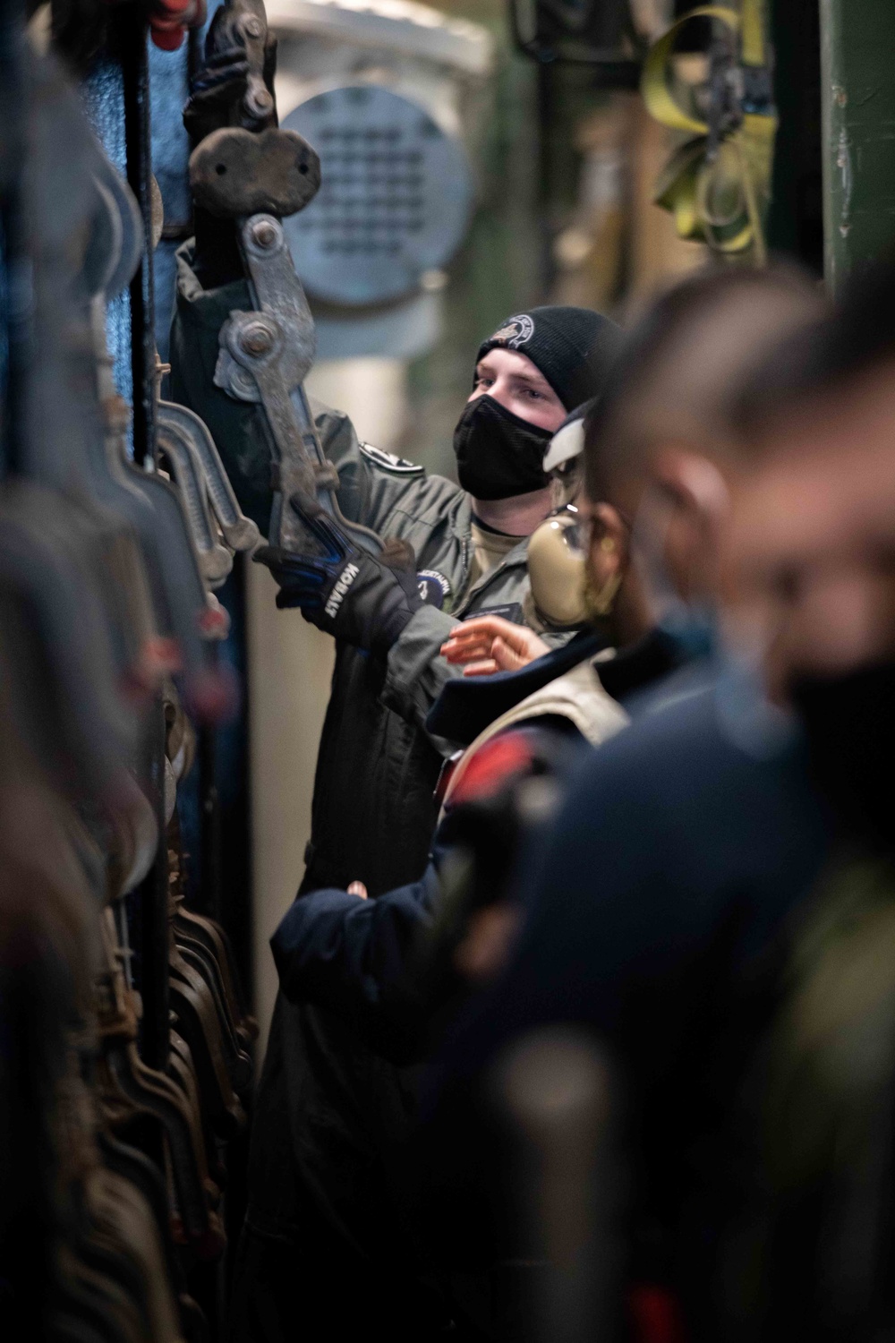 Sailors Work Together Aboard USS Arlington