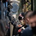Sailors Work Together Aboard USS Arlington