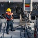 USS Arlington Sailor Directs Knuckle Boom Crane