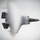 A fifth-generation stealth fighter jet, consistent with an F-35 Lightning II, is photographed from above during a high-performance maneuver. The aircraft is surrounded by a dramatic vapor cone or condensation cloud, along with dark exhaust smoke from the engine, indicating high thrust and humid atmospheric conditions. The top-down perspective provides a clear view of the aircraft's stealth-optimized planform and delta-wing configuration.
