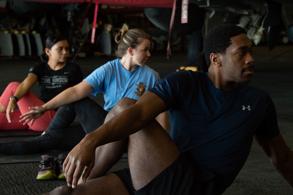 USS Carl Vinson (CVN 70) Sailors Participate in Yoga Class