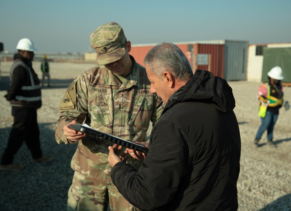 Peshmerga soldiers engage with Iraq